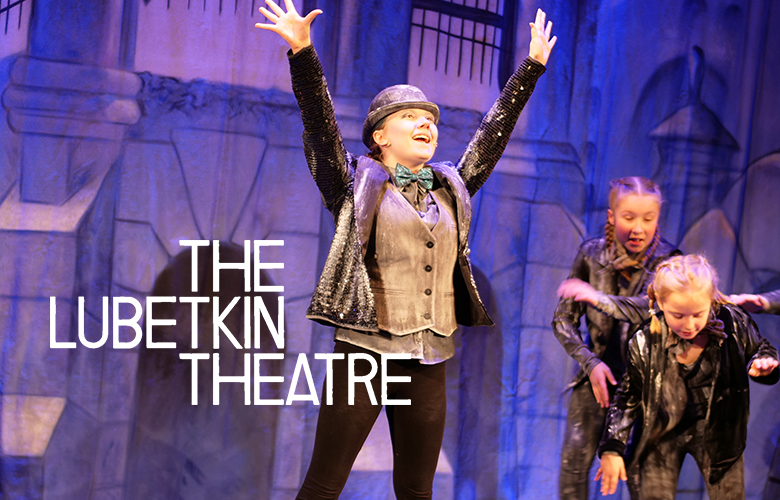 Performance by three people on stage with The Lubetkin Theatre logo overlaid
